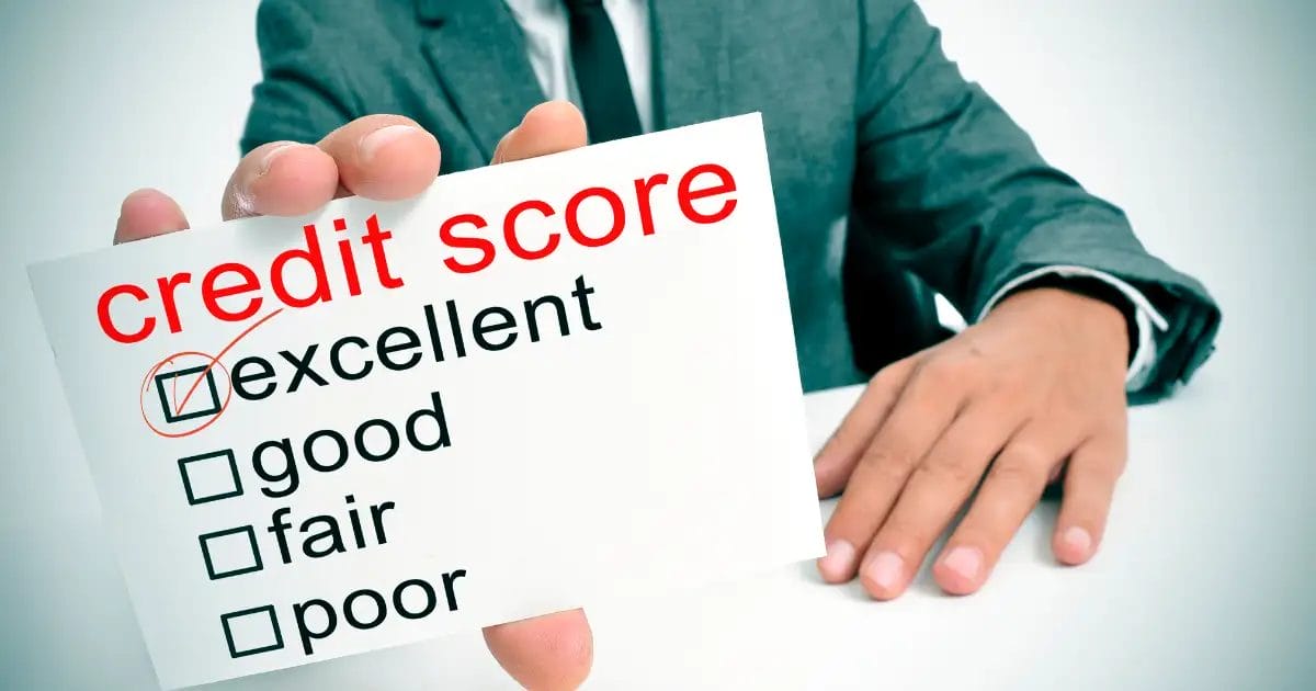 Person holding a sign showing "credit score" with "excellent" checked off.
